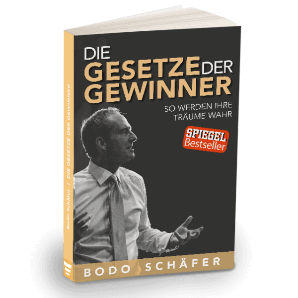 Die besten Bücher von Bodo Schäfer: Erfolgsstrategien für dein finanzielles Wachstum "Buchcover von 'Die Gesetze der Gewinner' von Bodo Schäfer. Das Cover zeigt einen Mann im Anzug, der nach vorne spricht und gestikuliert. Der Titel ist in großen goldenen und weißen Buchstaben geschrieben, mit dem Untertitel 'So werden Ihre Träume wahr'. Ein rotes Siegel mit der Aufschrift 'SPIEGEL Bestseller' ist ebenfalls auf dem Cover zu sehen.