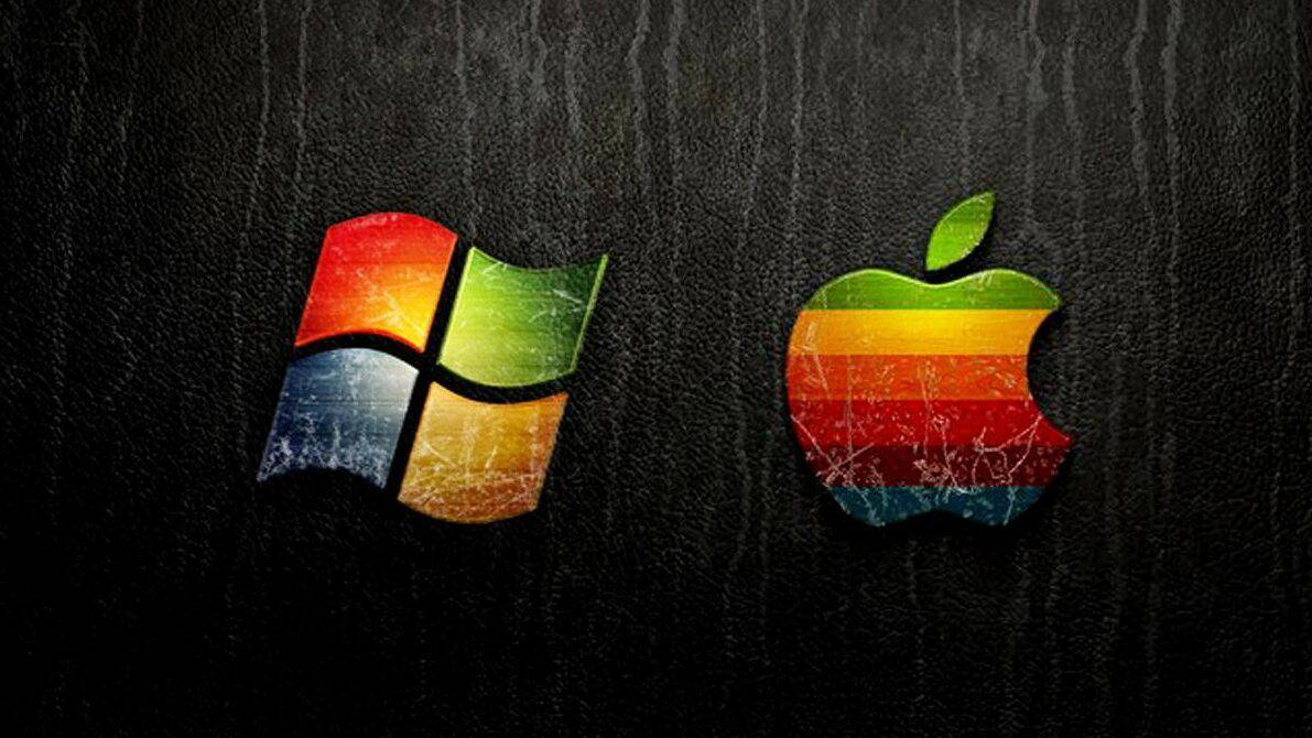 Der beste Trading-Computer: Alles, was Sie für den Einstieg wissen müssen Das Bild zeigt das Logo von Apple und Windows.